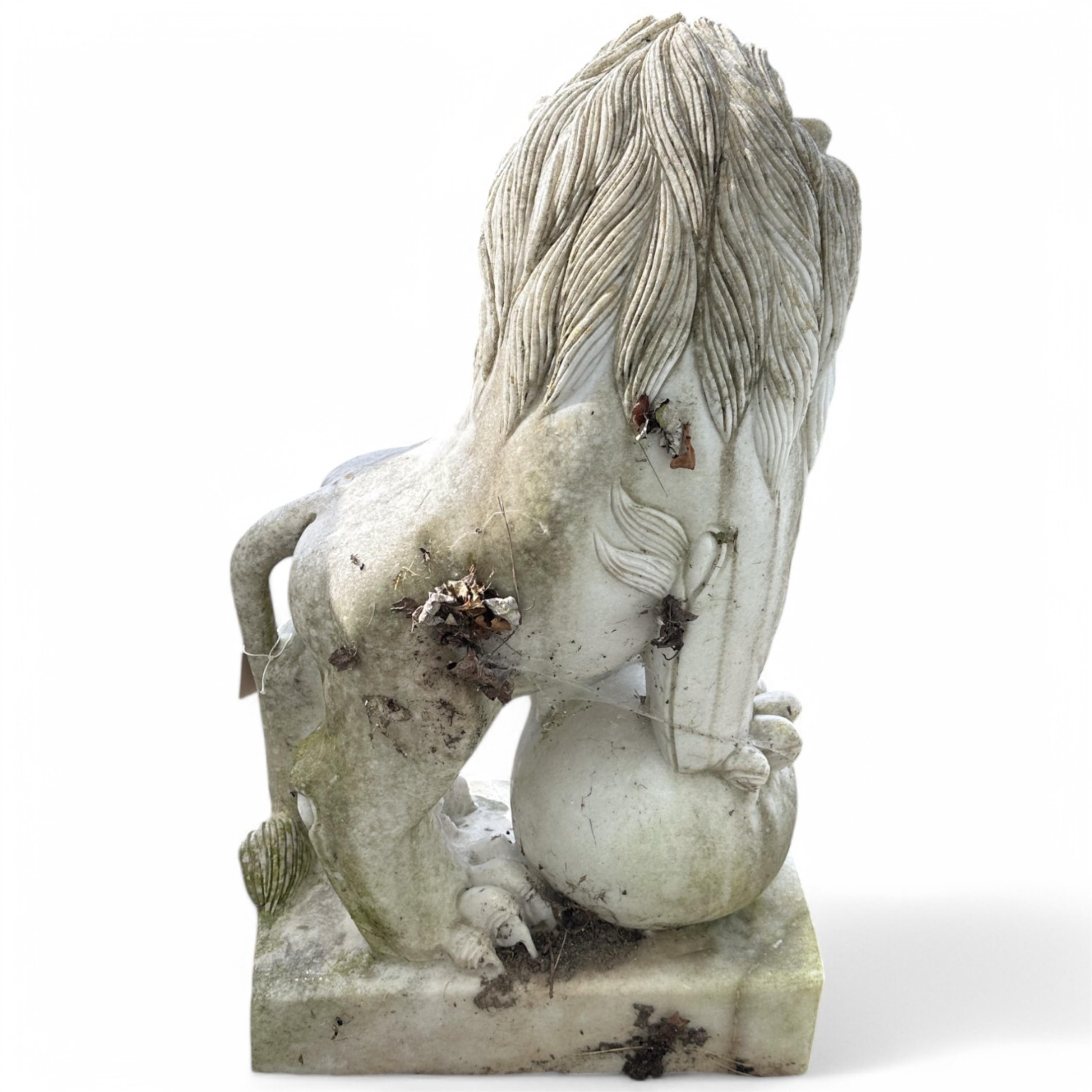 A pair of reconstituted white marble models of lions rampant